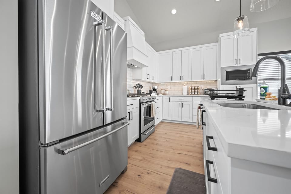 Cook your favorite meals in a kitchen bathed in natural light that enhance the culinary experience.