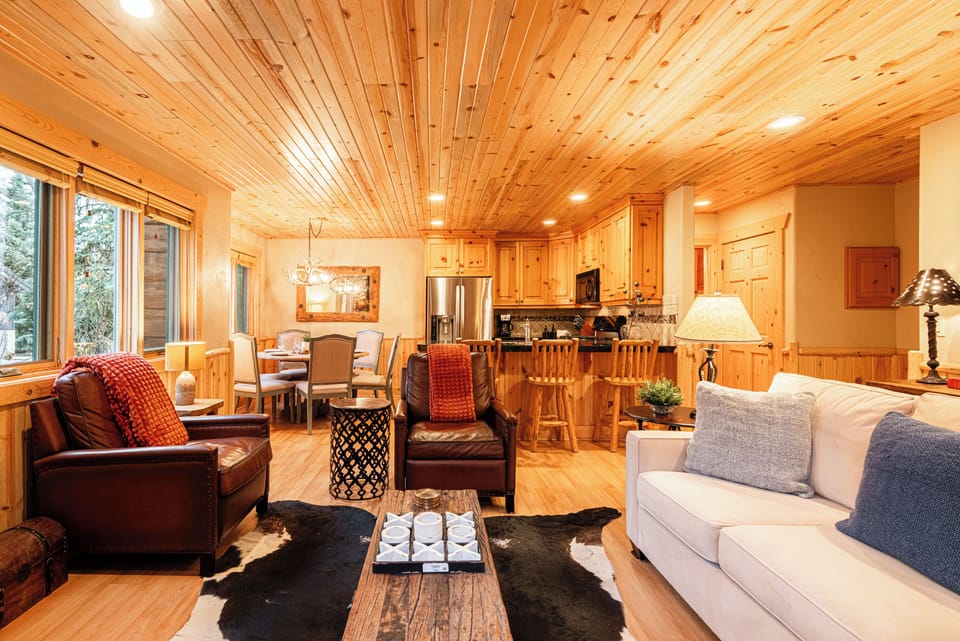 Main Living Space with Queen Sofa Sleeper, Gas Fireplace, TV, & Patio Access