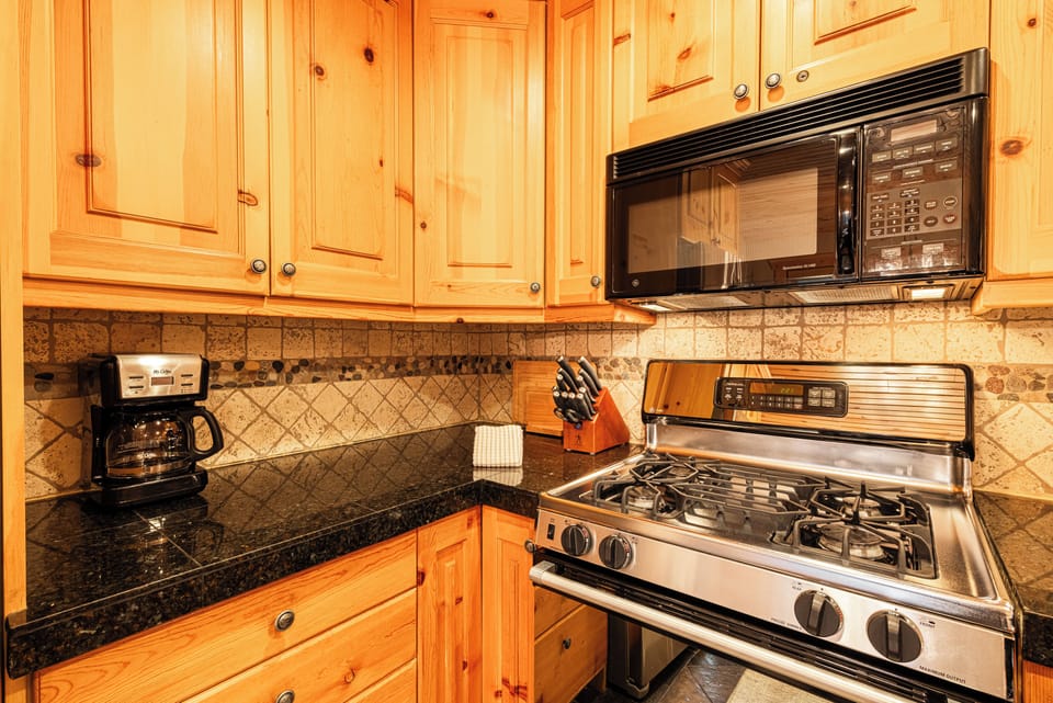Fully Equipped Kitchen with Stainless Steel Appliances, Gas Range, & Drip Coffee Maker