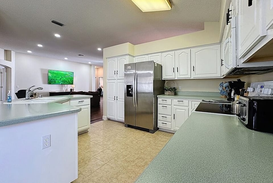 Kitchen opens into living room.