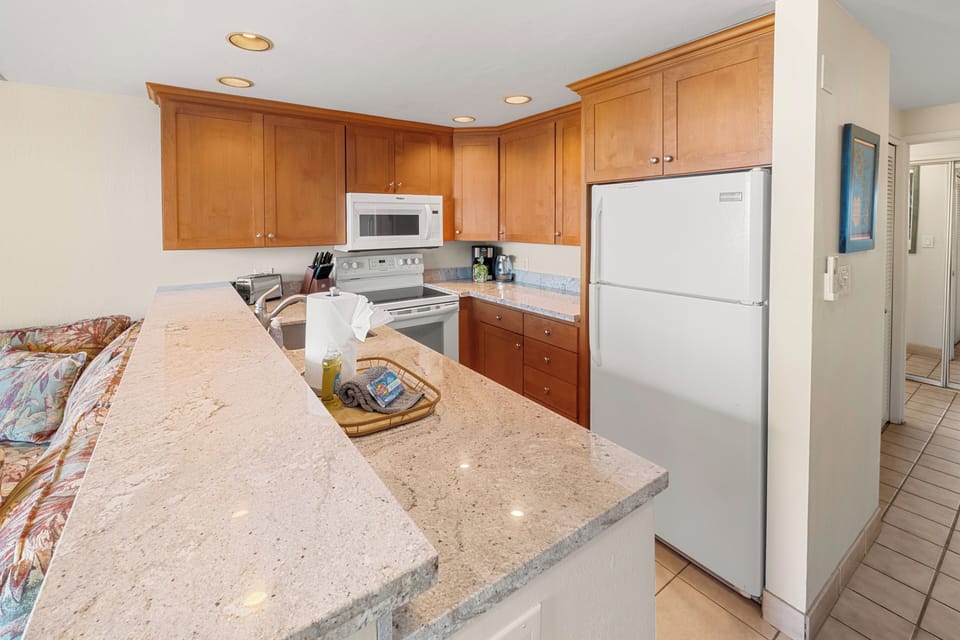Equipped kitchen with full-size appliances.