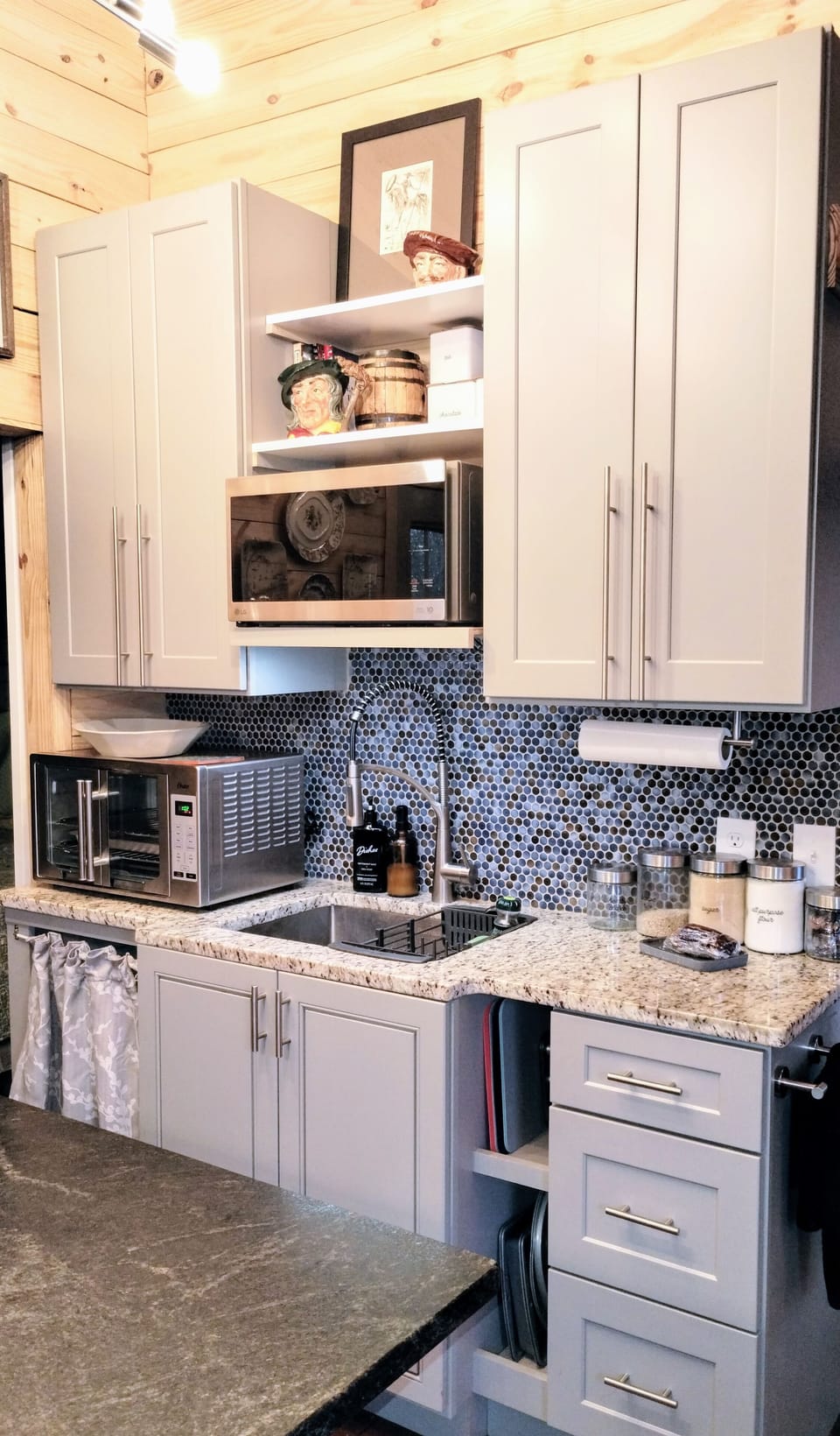 Efficiency Kitchenette w/ countertop oven, stone counters, microwave, cooktop