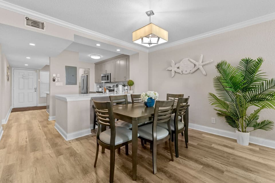 Spacious dining room featuring seating for six.