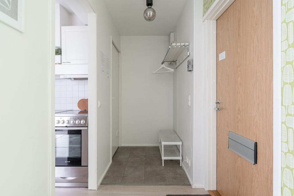 A clean and organized entryway welcomes you with space for your outdoor gear and easy access to all rooms.