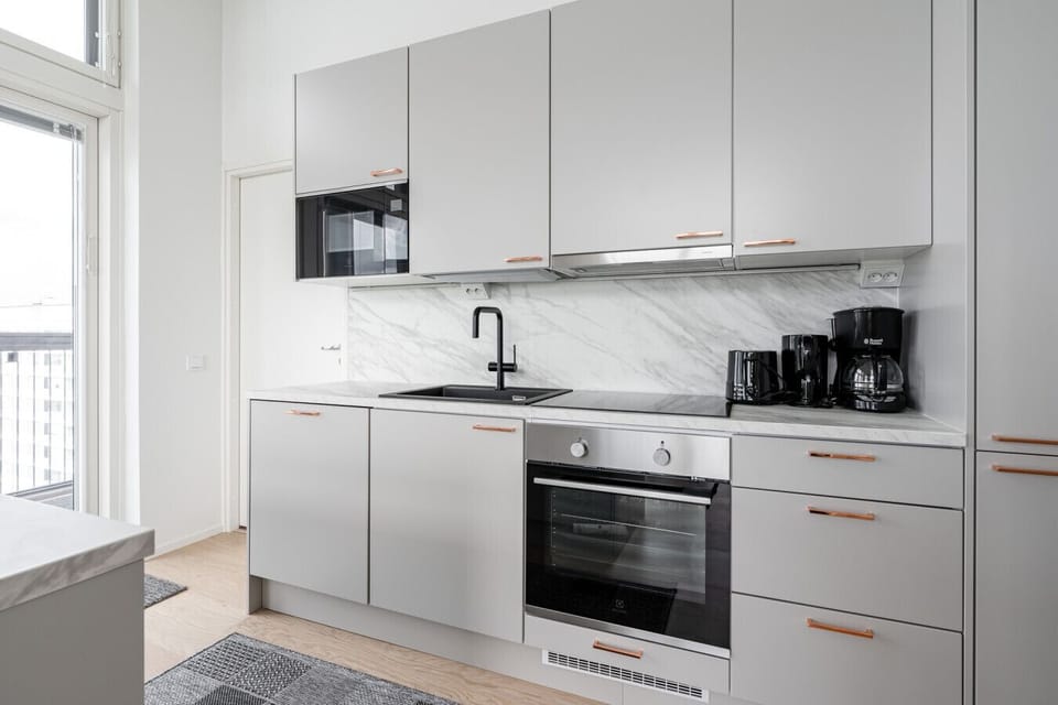 The modern kitchen is fully equipped with high-quality appliances and essential cookware, making it easy to prepare everything from breakfast to dinner.