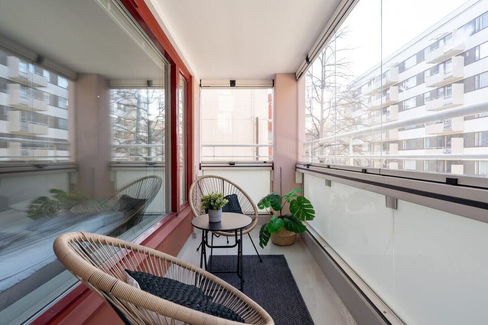 Enjoy your coffee or a quiet moment in this private, year-round balcony space. It serves as a relaxed extension of the living area, separate from the apartment interior.