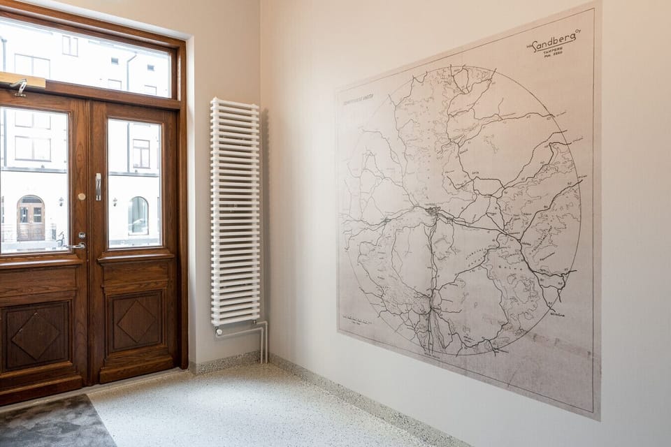 Experience the grandeur of the 19th-century Sandberg House from the moment you step into the beautifully preserved, historic foyer.