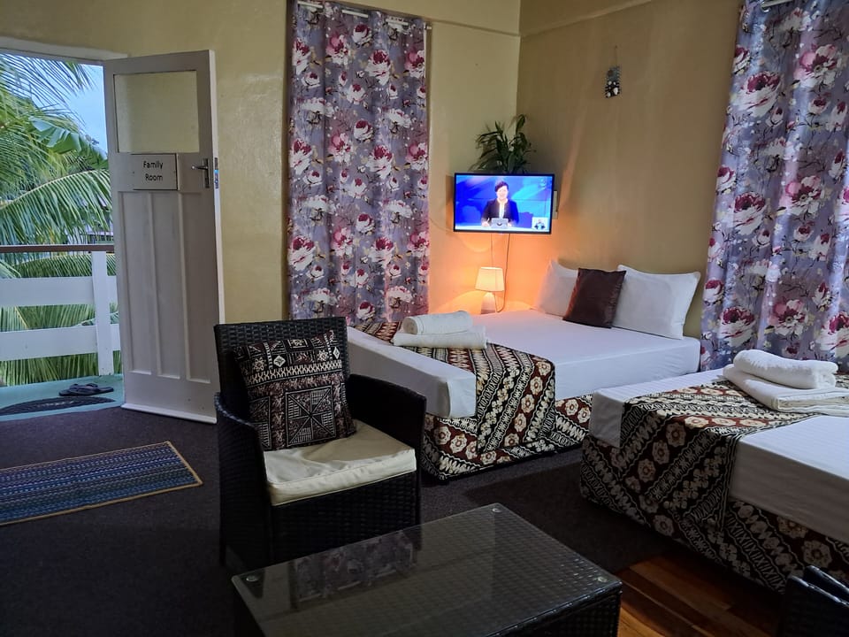 Family Apartment, Ocean View | Iron/ironing board, bed sheets
