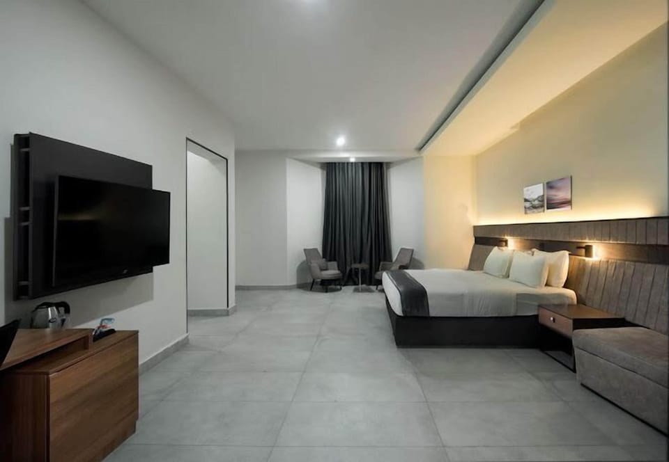 Economy Room, Balcony, City View | Desk, laptop workspace, blackout drapes, soundproofing