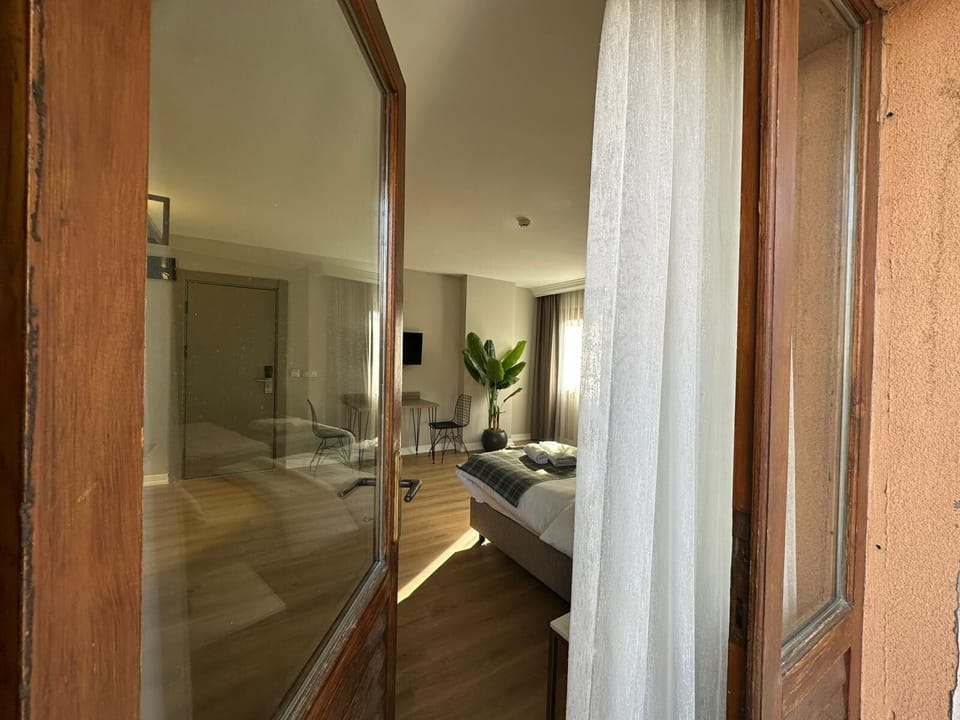 City Triple Room, Balcony, City View | In-room safe, laptop workspace, soundproofing
