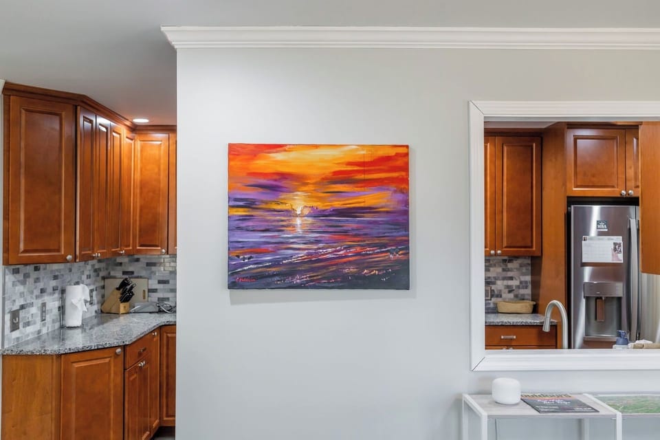 Vibrant artwork and an open layout add warmth and character to the space.