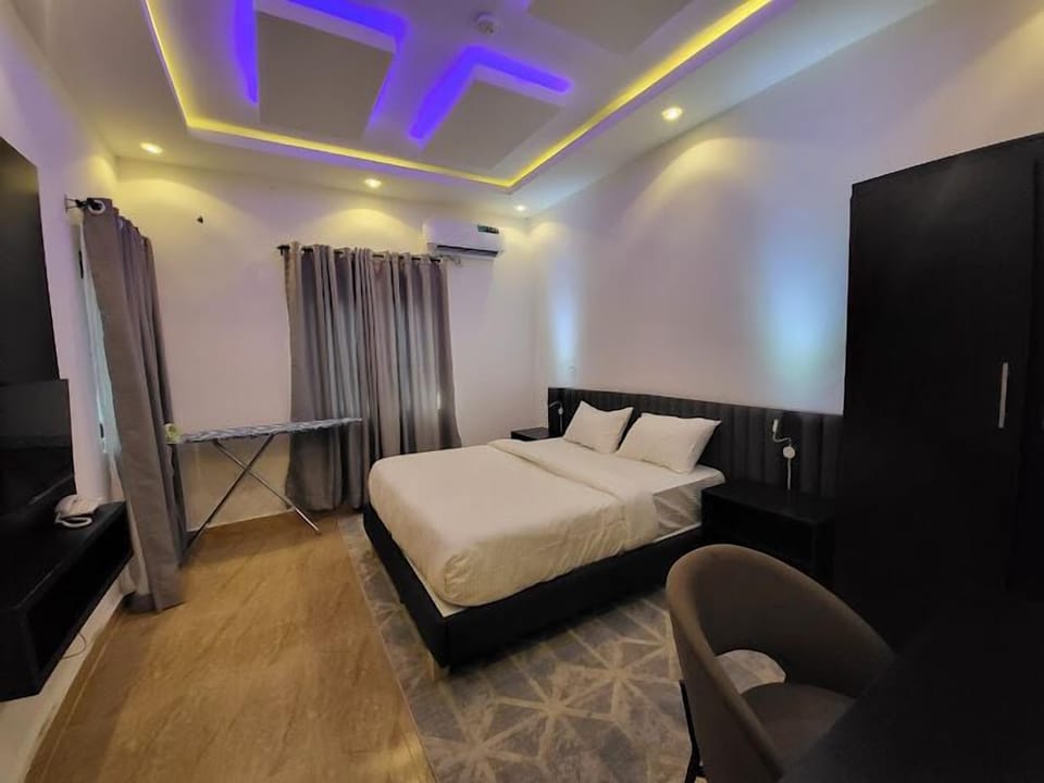 Deluxe Room, Balcony, City View | Desk, laptop workspace, blackout drapes, soundproofing
