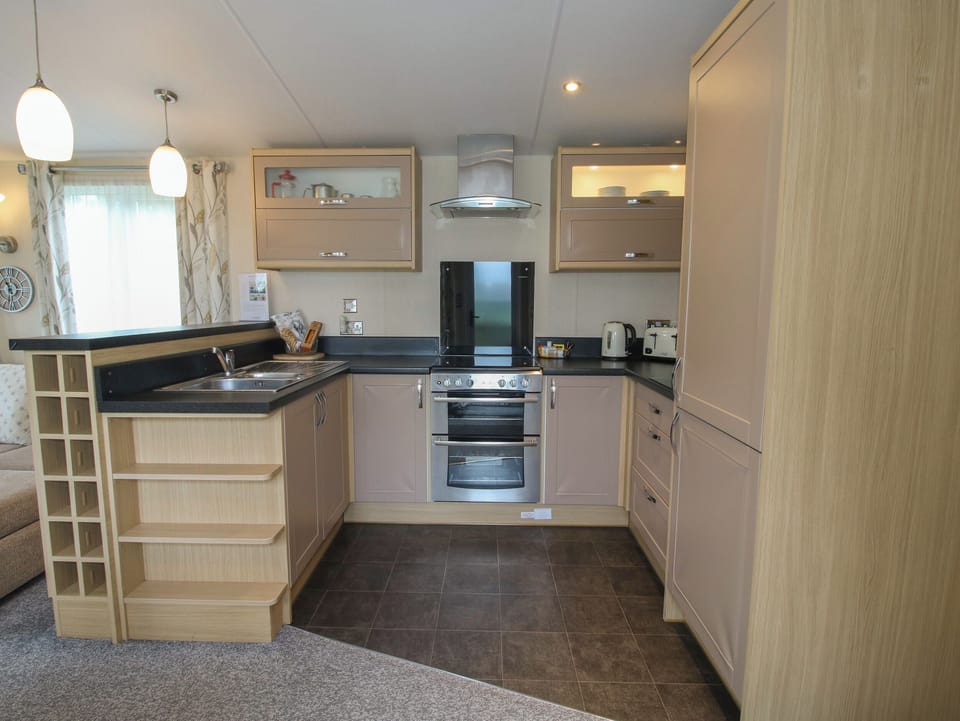 Fridge, electric kettle, toaster, cookware/dishes/utensils