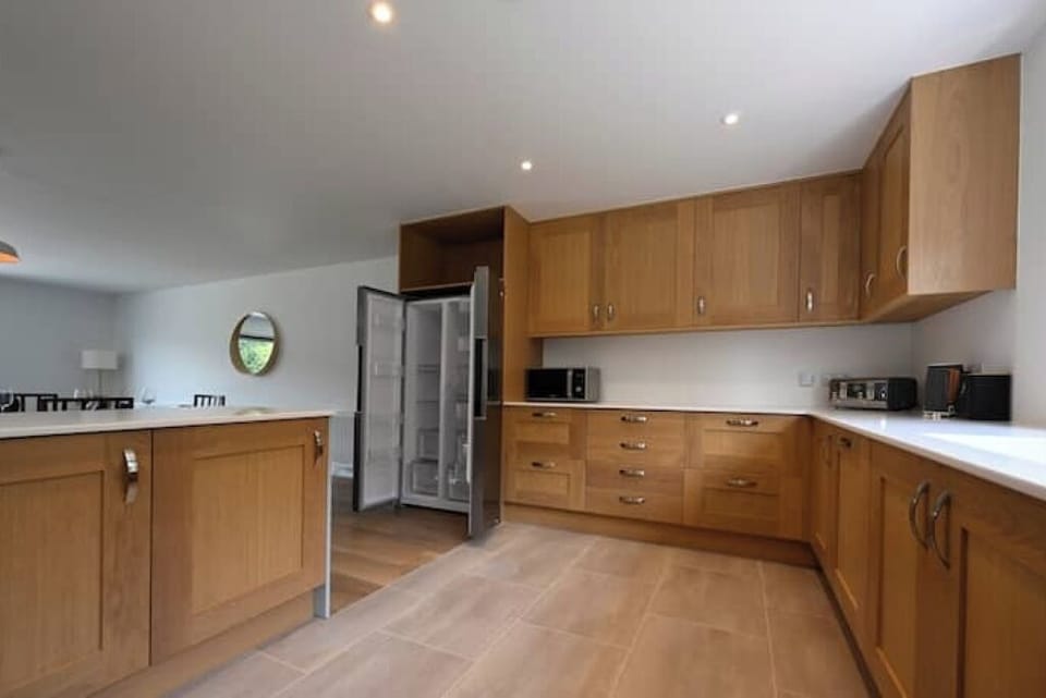 Kitchen with large refrigerator and freezer.