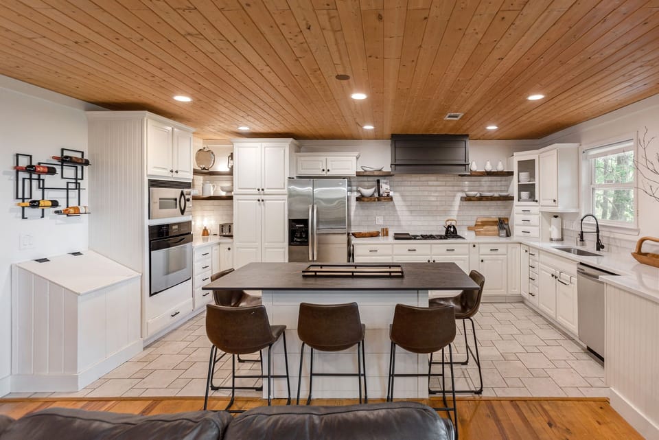 The chef's kitchen is equipped with all essentials to prepare a meal at home. 
