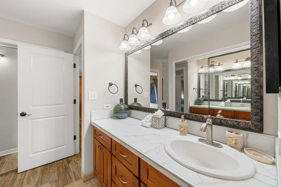 The well-lit vanity adds a touch of luxury to your daily routine.