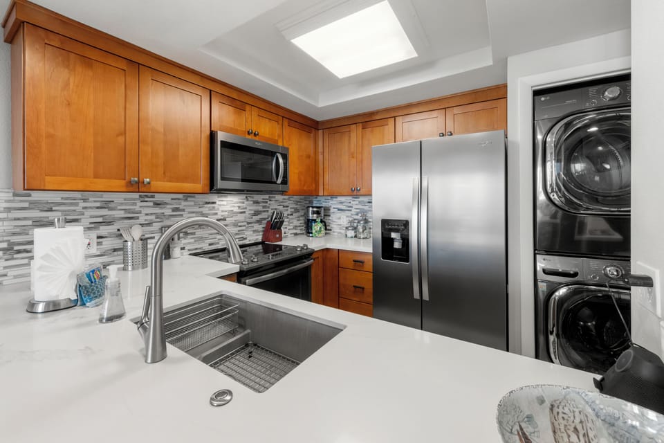 Tucked conveniently within the kitchen, the full-size washer and dryer make it easy to refresh beachwear and travel clothes without missing a moment of your vacation.