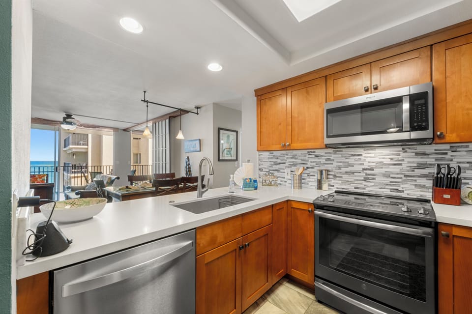 This thoughtfully designed kitchen lets you take in the sparkling Pacific as you prepare meals, blending the joy of island living with everyday convenience.