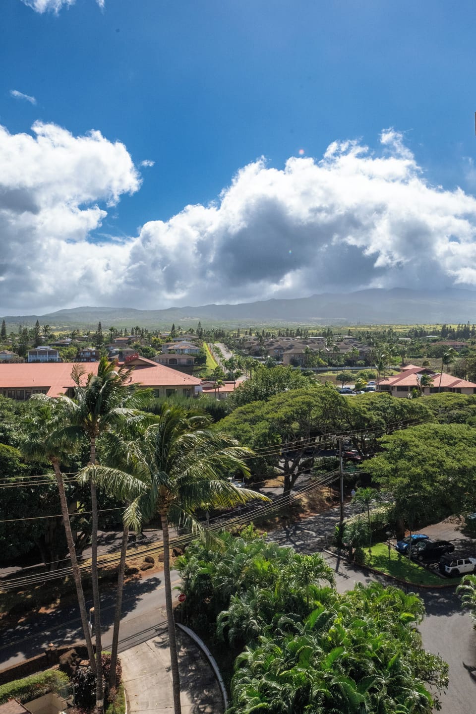 Wake up to breathtaking views of the majestic West Maui Mountains from the second bedroom's private lanai access.