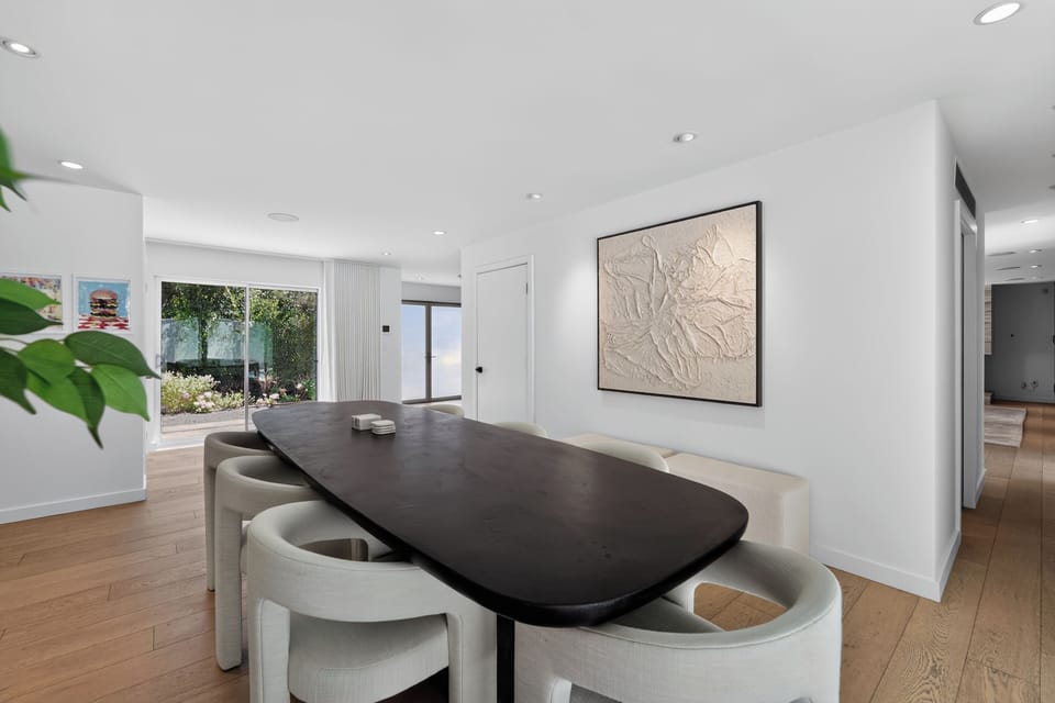 Enjoy the best of indoor-outdoor living with large doors that open directly from the dining area to the pool.