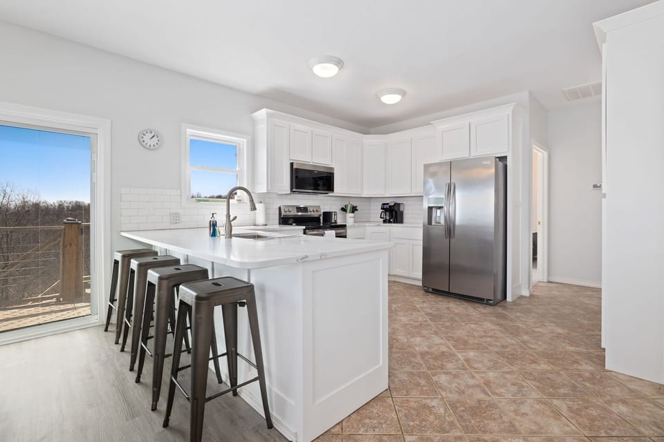 This is entire space is flooded with natural light and boasts gorgeous views of Beaver Lake from every angle.