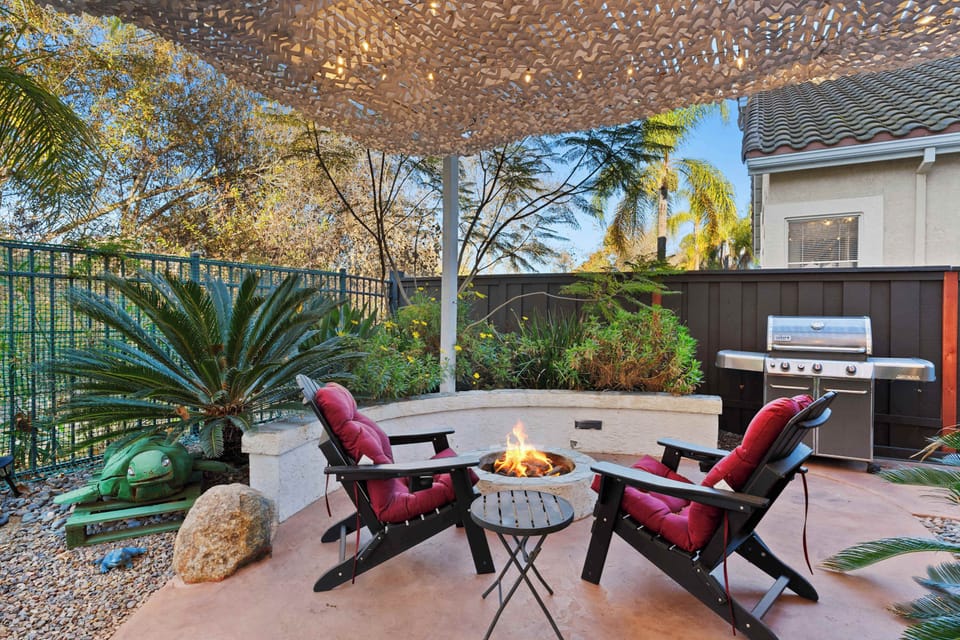 Outdoor seating, another seating around a dining table, BBQ, and a fireplace