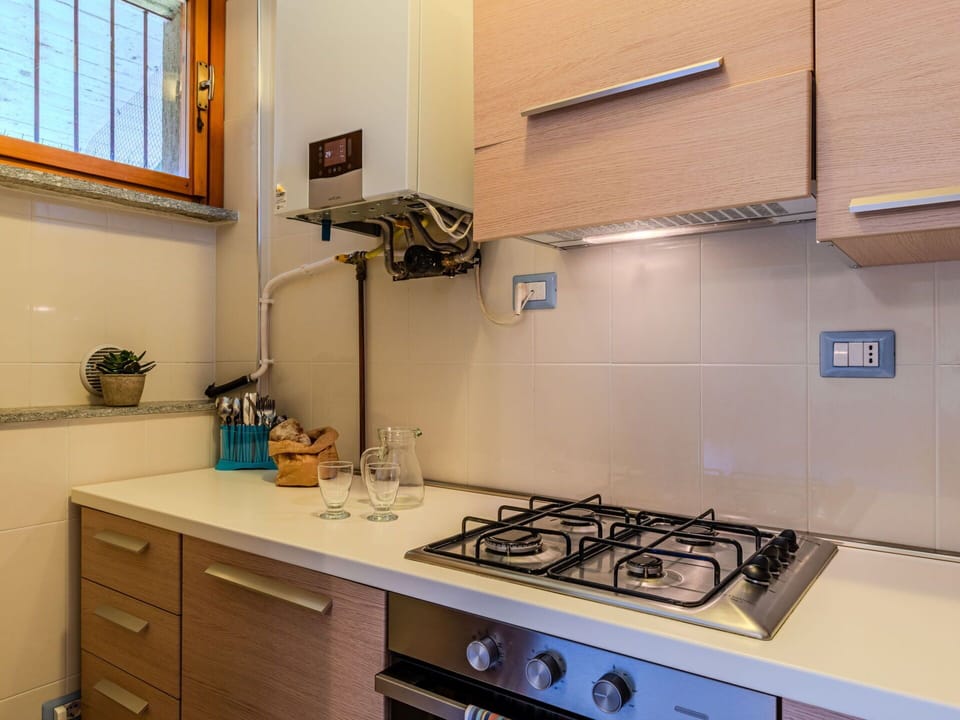 Kitchen Appliance, Kitchen, Countertop, Major Appliance, Cabinetry, Home Appliance, Kitchen Sink, Kitchen Stove, Stove, Interior Design