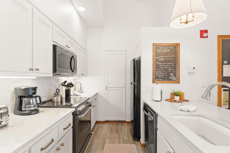 Full updated kitchen with breakfast bar seating 2.
