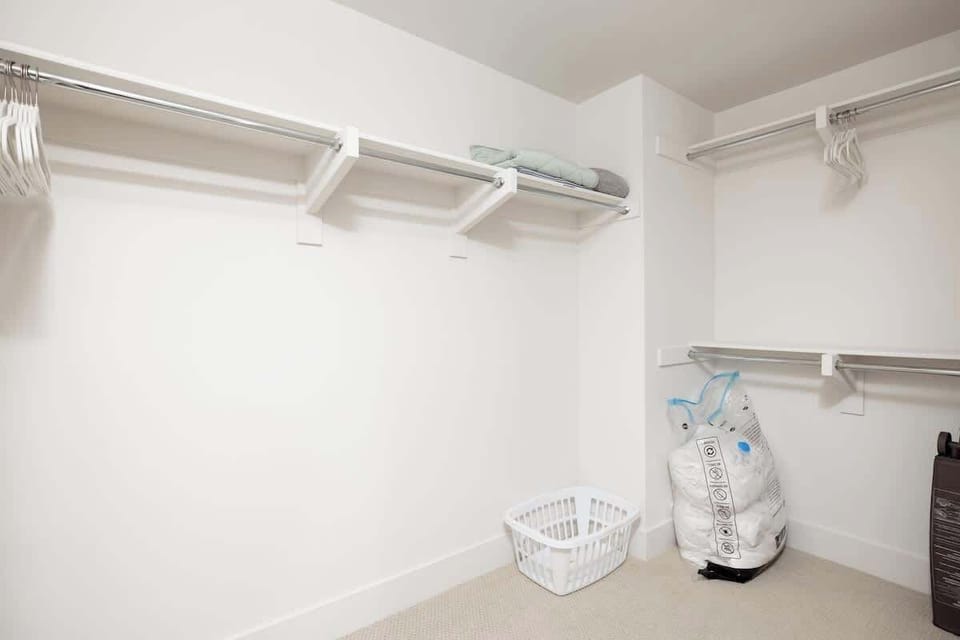 Huge walk-in closet attached to the primary suite. Perfect for longer stays!