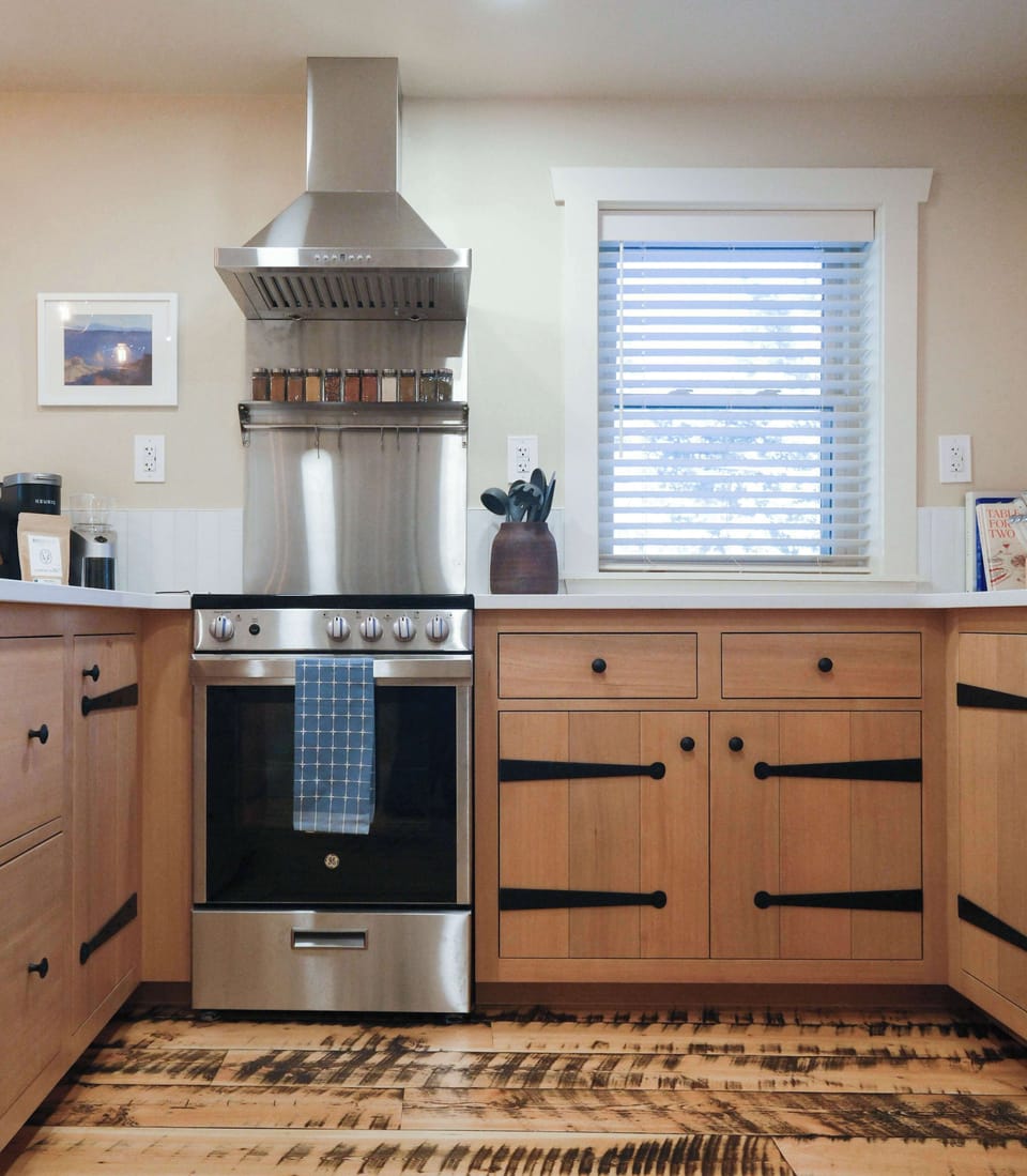 Fully stocked kitchen with custom craftsman cabinets.
