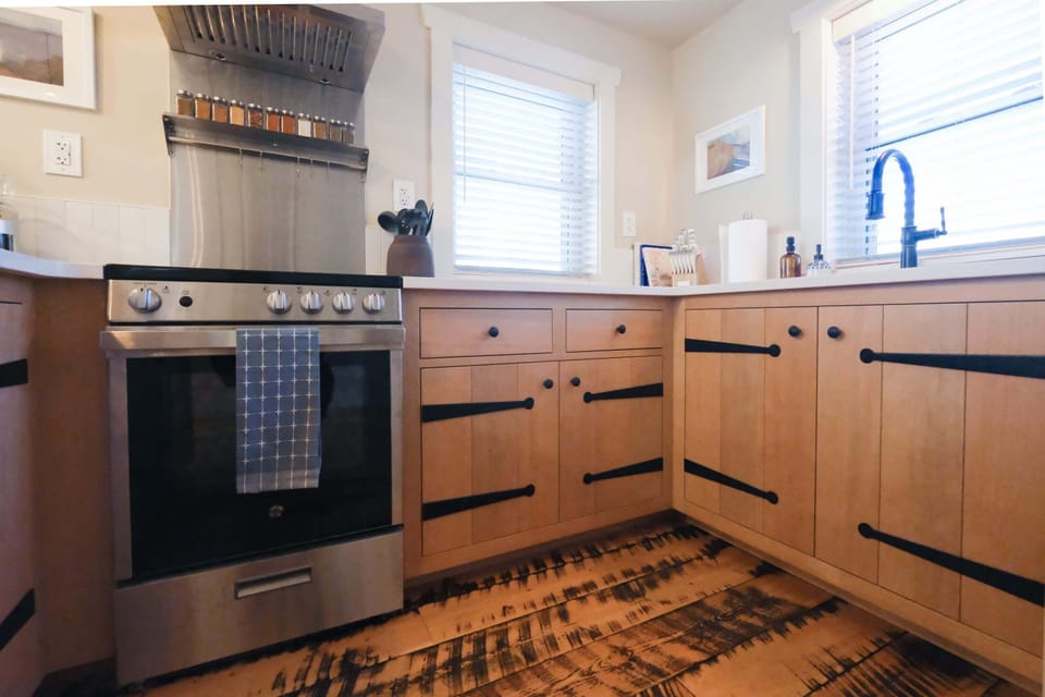 Fully stocked kitchen with custom craftsman cabinets.