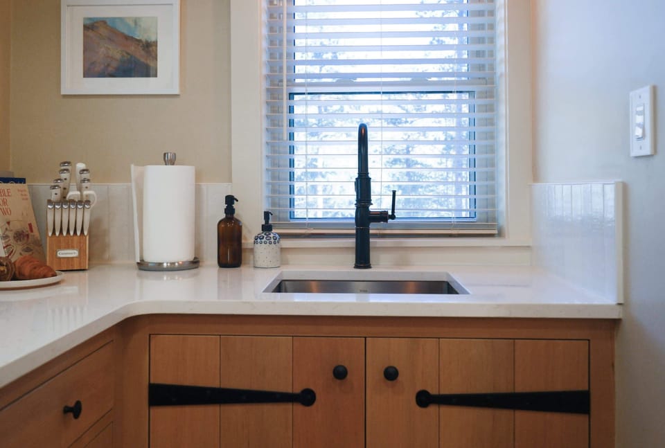 Fully stocked kitchen with custom craftsman cabinets.