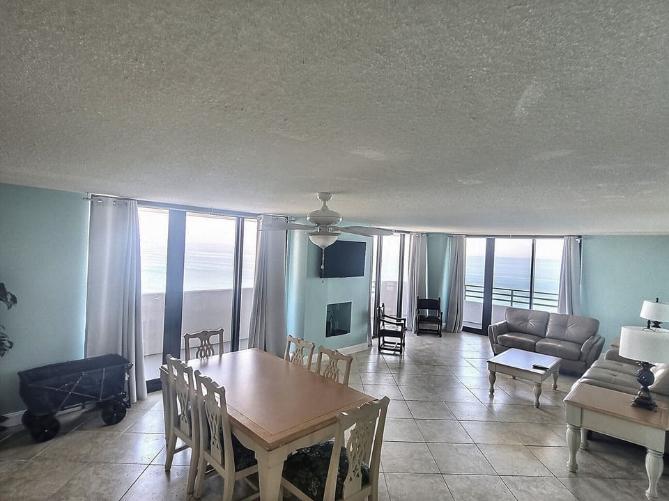 Open living and dining room with wrap around balcony