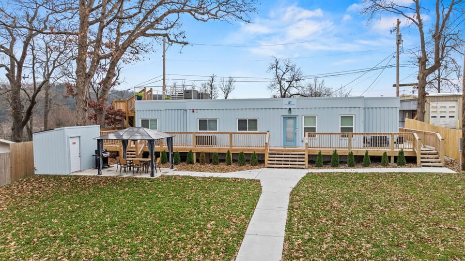 Enjoy a one-of-a-kind stay in this custom shipping container home with a huge deck and outdoor seating.