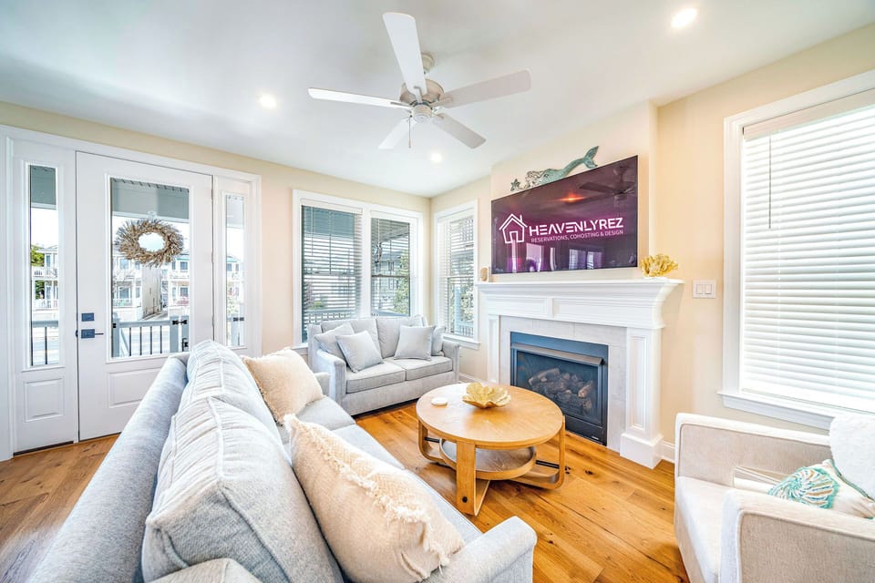 Open living room area with fireplace and flatscreen TV
