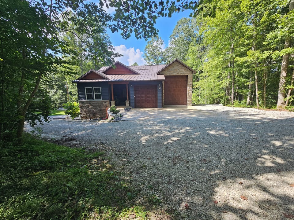 Front view of home, the forest surrounds you!