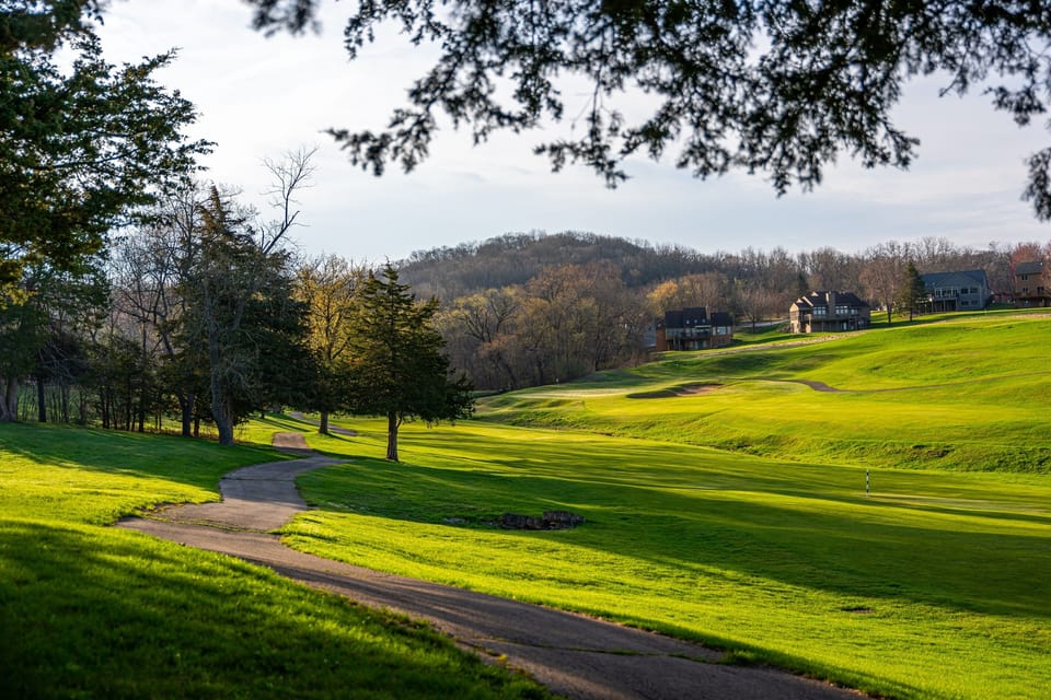 Backs up to South Golf Course. Take a right on the path and it's a quick 3 min walk to the club house. Not a golfer?  Take a walk on the golf path, it's beautiful! (personal favorite)