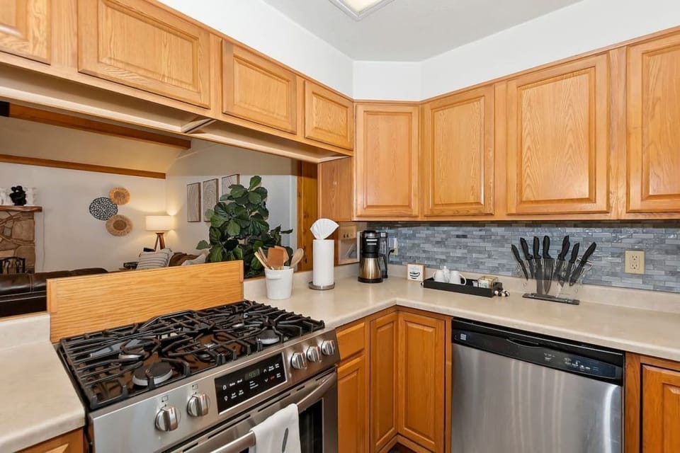 The cabin's kitchen is fully stocked, and features a microwave, dishwasher, blender, toaster and a coffee pot. (coffee not provided)