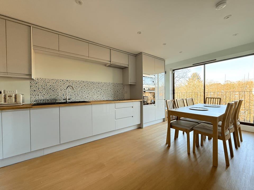 Comfort Townhome | Private kitchen | Full-size fridge, microwave, oven, stovetop