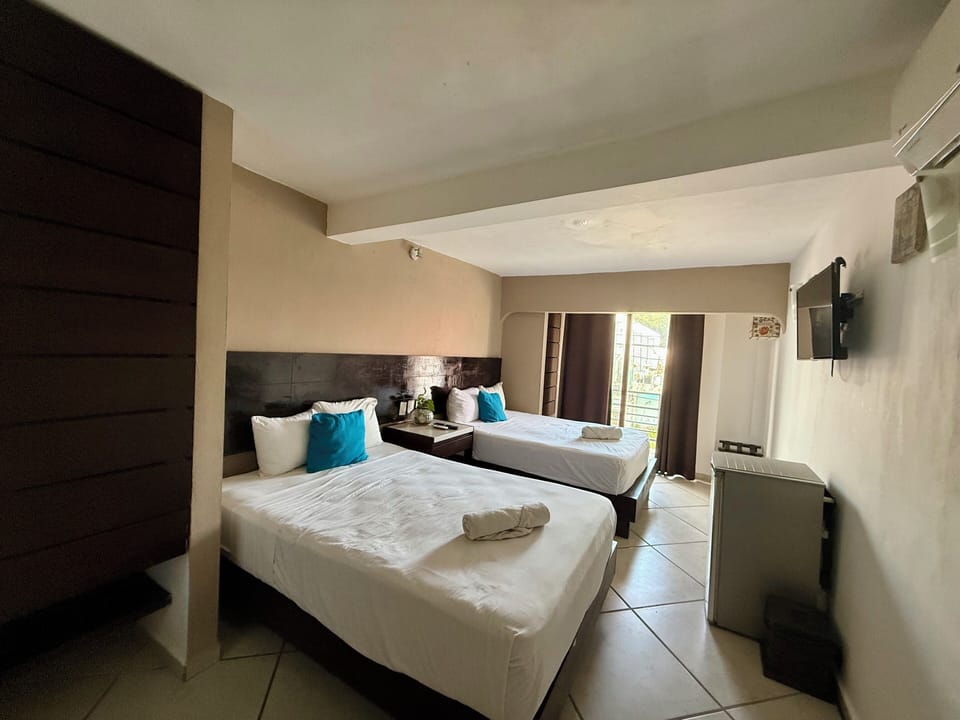 Deluxe Suite, 2 Queen Beds, Balcony, City View | 1 bedroom, minibar, WiFi (free)