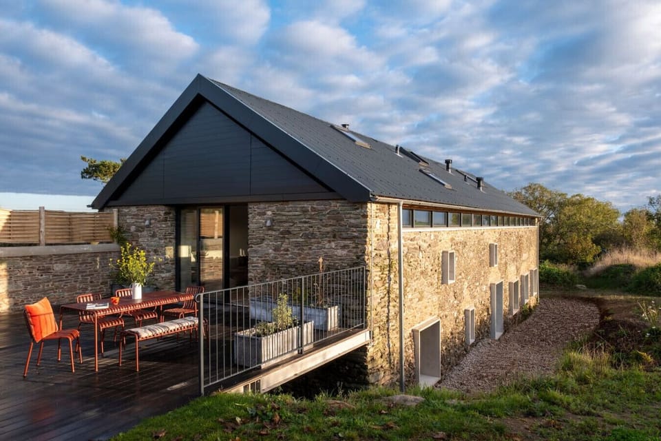 The whole of the first floor is living space and kitchen and the back half of the ground floor is bedrooms and bathroom.
