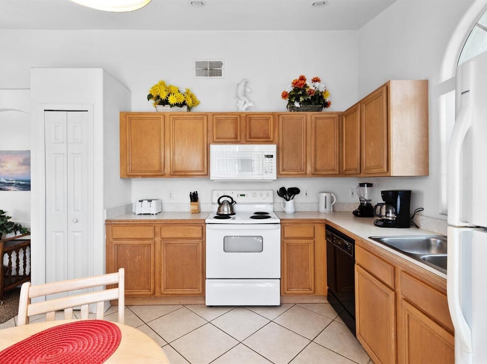 With top-of-the-line appliances, ample counter space, and a large island, it's the perfect space for preparing meals while still being part of the conversation or entertainment.