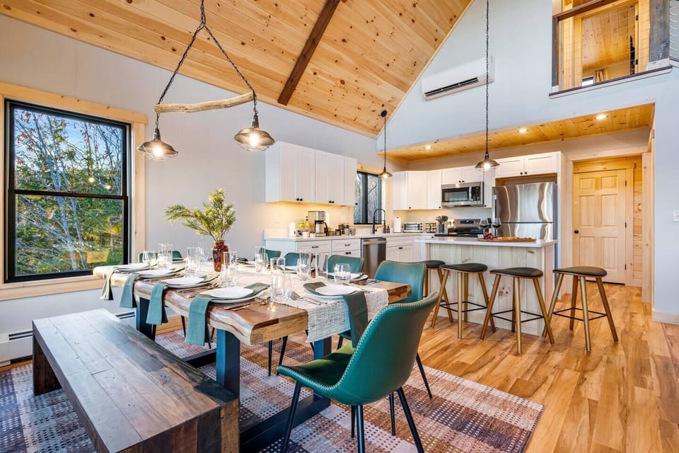 Gather at our elegant dining table for 12 & kitchen island for 4.
