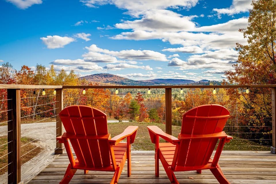 Mesmerize in breathtaking mountain views & foliage on comfy Adirondack chairs.