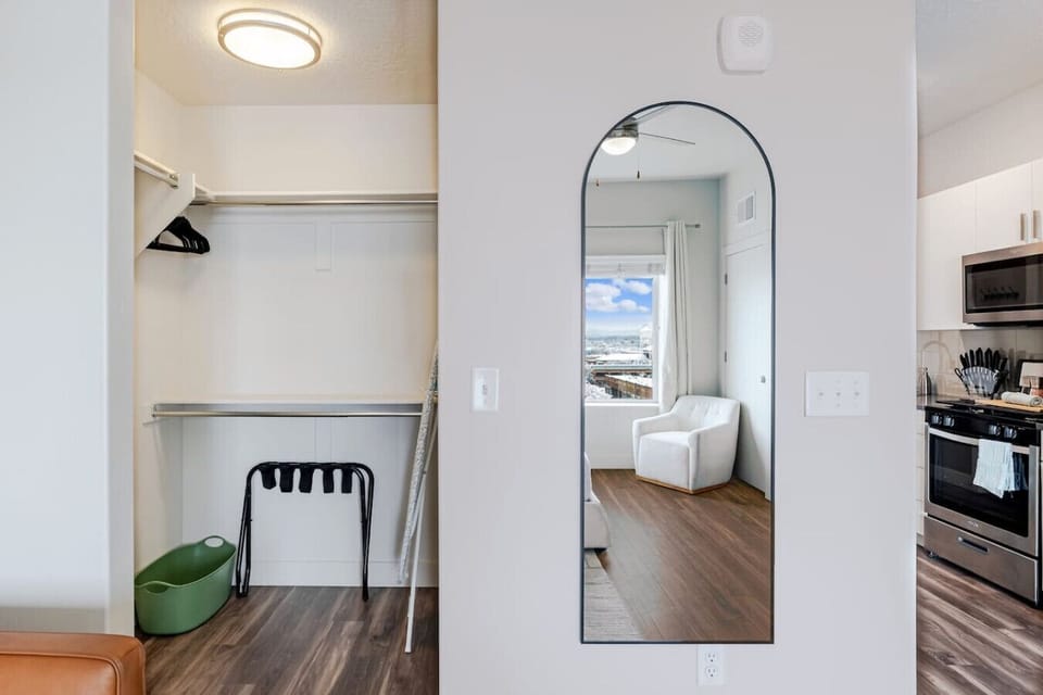 Walk In closet. Vacuum cleaner. Ironing board. Laundry basket. Luggage rack
