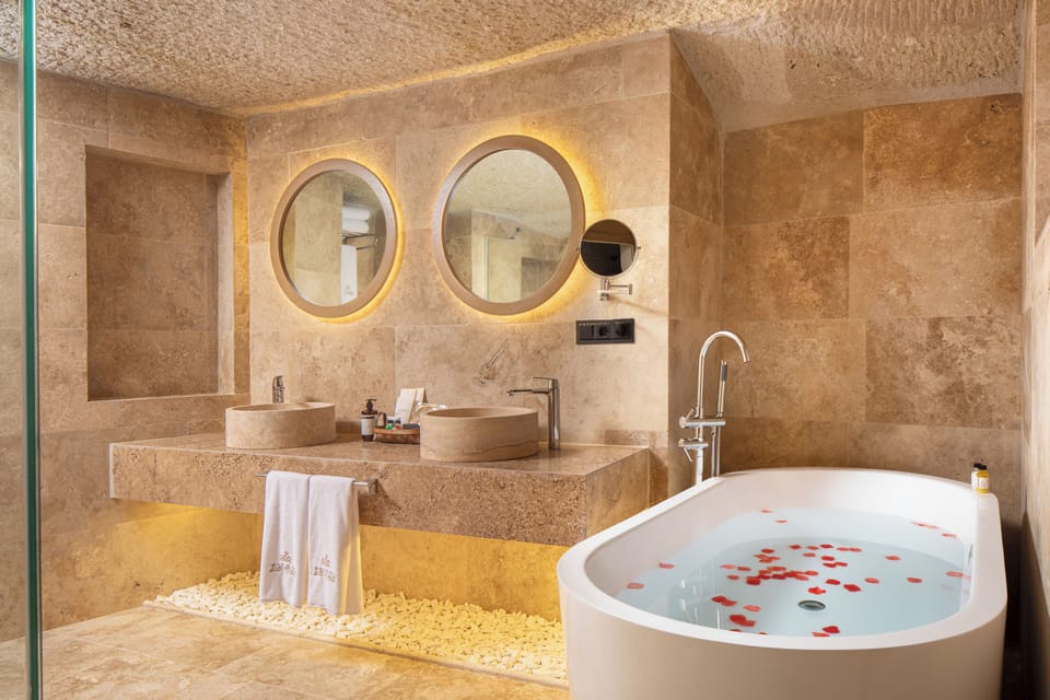 Family Cave Suite | Bathroom | Designer toiletries, hair dryer, bathrobes, slippers