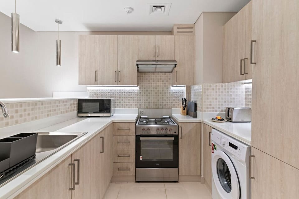 Kitchen: Modern design with sleek appliances for culinary adventures in Dubai!