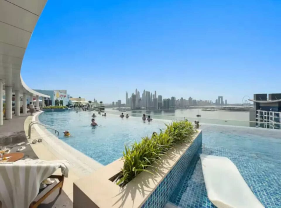 Rooftop Oasis: Infinity pool with stunning skyline views—dive into luxury under the sun!