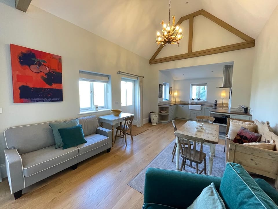 Sofas, living space, kitchen table and desk