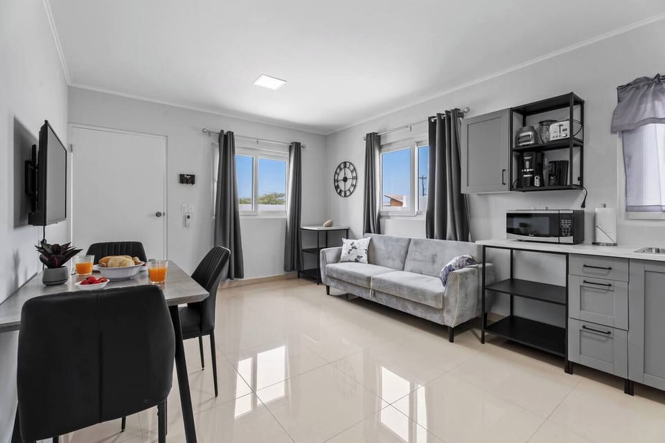 Open-concept living space with a kitchen and dining area.

